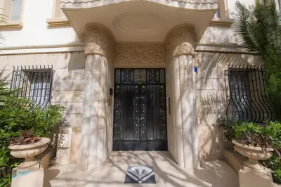 a building with a black door with two columns at SEA PEARL Luxury apartament by the Croisette and the beach in Cannes
