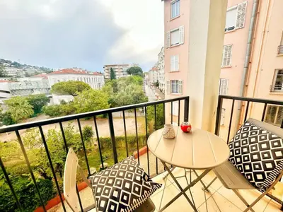 a balcony with a table and chairs and a view at SEA PEARL Luxury apartament by the Croisette and the beach in Cannes