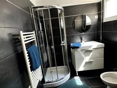 a bathroom with a shower and a toilet and a sink at Grand Studio Centre Cannes in Cannes