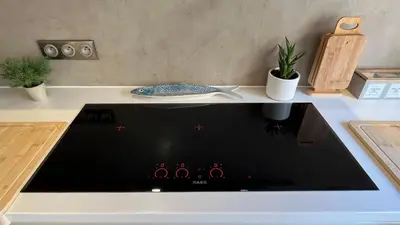a stove top oven with a plate on top of it at Residence Sao Jorge in Cannes