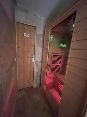 an empty room with a door and a red light at Residence Sao Jorge in Cannes