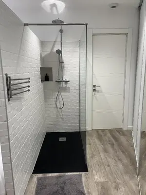 a shower with a glass door in a bathroom at Residence Sao Jorge in Cannes