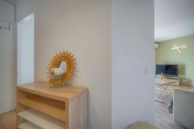 a living room with a table with a mirror at Studio Moderne BALCON, proche FORVILLE- CENTRE CANNES A0B198 in Cannes