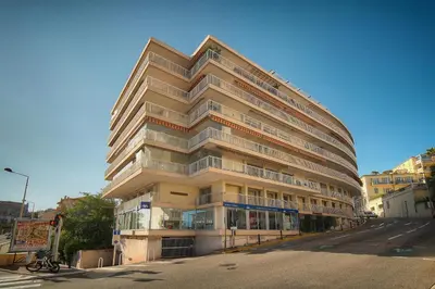 a tall building on the side of a street at Studio Moderne BALCON, proche FORVILLE- CENTRE CANNES A0B198 in Cannes