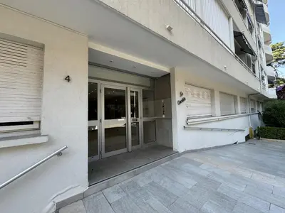 a facade of a building with doors and windows at 2P proche mer sib06 in Cannes