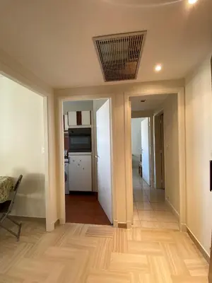 a hallway of a house with a kitchen and a ceiling at Belle terrasse apercu mer NAF568 in Cannes
