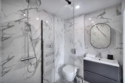 a bathroom with a shower and a toilet and a sink at Moderne 2 chambres TERRASSE, MARTINEZ CARLTON A2B249 in Cannes