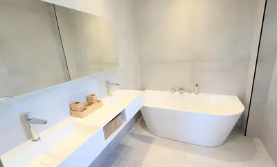 a white bathroom with a tub and a sink at Ref VCLAIR by Palmes dProperties in Cannes