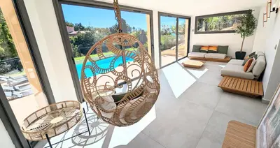 a room with a hanging hammock in a house at Ref VCLAIR by Palmes dProperties in Cannes