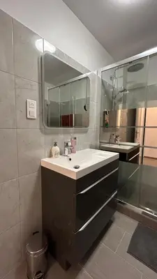 a bathroom with a sink and a mirror at SINT Cannes T 1 in Cannes