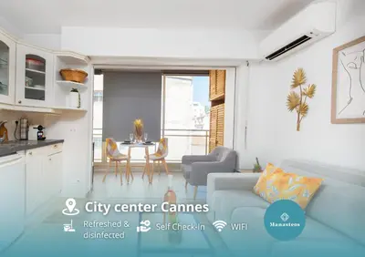 a living room with a couch and a table at Hypercentre - Plage - Croisette - Palais - CJ in Cannes