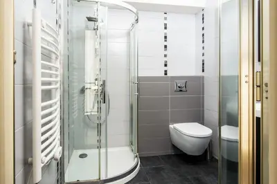 a bathroom with a glass shower and a toilet at Hypercentre - Plage - Croisette - Palais - CJ in Cannes