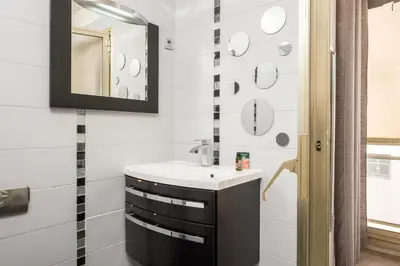 a bathroom with a sink and a mirror at Hypercentre - Plage - Croisette - Palais - CJ in Cannes