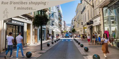 a group of people walking down a city street at Studio W - Ascenseur - 2 min du Palais - Climatisé in Cannes