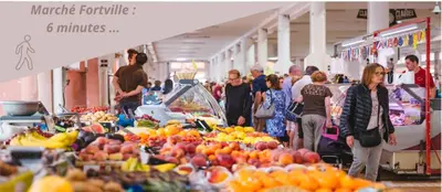 a group of people walking around a market with fruits and vegetables at Studio W - Ascenseur - 2 min du Palais - Climatisé in Cannes