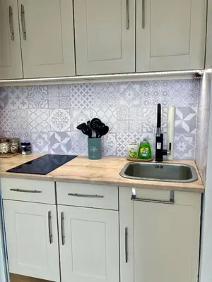 a kitchen with a sink and a counter top at Cannes Centre Apartment 2-Room by Palais des Festivals & Beach in Cannes