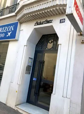 a entrance to a building with a revolving door at Cannes Centre Apartment 2-Room by Palais des Festivals & Beach in Cannes