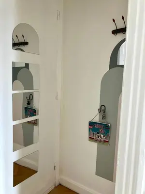 a room with a wall with two shelves at Cannes Centre Apartment 2-Room by Palais des Festivals & Beach in Cannes