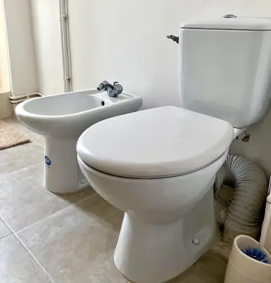 a bathroom with a white toilet and a sink at Cannes Centre Apartment 2-Room by Palais des Festivals & Beach in Cannes