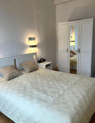 a bedroom with a large bed with two pillows at Cannes Centre Apartment 2-Room by Palais des Festivals & Beach in Cannes