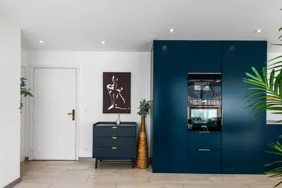 a blue cabinet in a hallway with a blue door at Hypercentre - Palais - Croisette - Plage - CI in Cannes