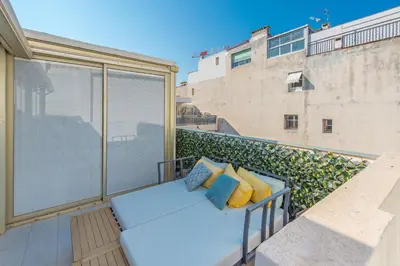 a balcony with a couch and pillows on it at Hypercentre - Palais - Croisette - Plage - CI in Cannes