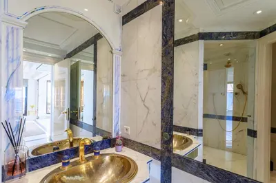 a bathroom with two sinks and a large mirror at Rare Penthouse - Vue panoramique in Cannes