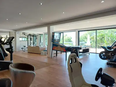 a living room with a pool table and a ping pong ball at Villa Caribbean in Cannes