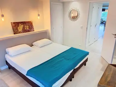 a bedroom with a large bed in a room at Superbe appartement terrasse vue mer 347L GLEN in Cannes