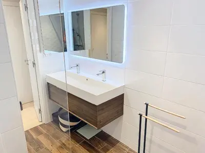 a bathroom with a sink and a mirror at Superbe appartement terrasse vue mer 347L GLEN in Cannes