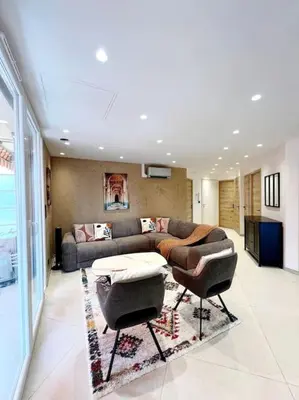 a living room with a couch and two chairs at Appartement 4 pièces luxueux in Cannes