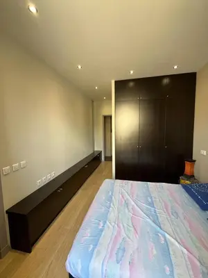 a bedroom with a large bed and a closet at dans le quartier historique du suquet idéal congres et vacances in Cannes