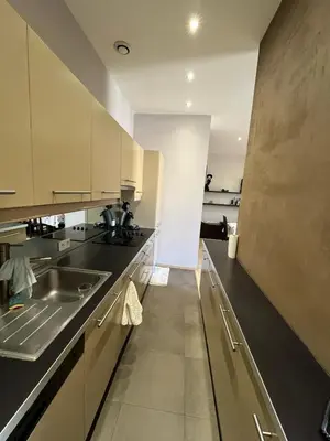 a kitchen with a sink and a counter at dans le quartier historique du suquet idéal congres et vacances in Cannes