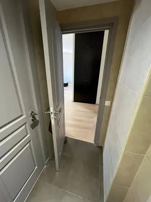 a hallway with a door leading to a room at dans le quartier historique du suquet idéal congres et vacances in Cannes