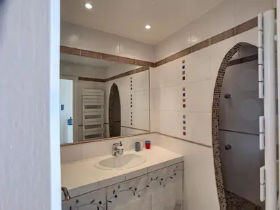 a bathroom with a sink and a mirror at Superbe vue mer terrasse - 218L MISS in Cannes