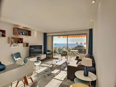 a living room with a view of the ocean at Superbe vue mer terrasse - 218L MISS in Cannes