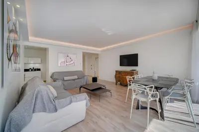 a living room with a couch and a table at REF 1425 - Cannes Center - Apartment for rent in Cannes