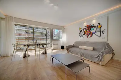 a living room with a couch and a table at REF 1425 - Cannes Center - Apartment for rent in Cannes