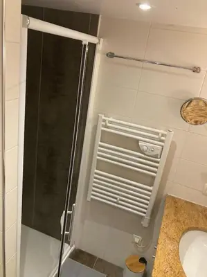 a shower with a glass door in a bathroom at Centre-ville de Cannes 100 m mer in Cannes