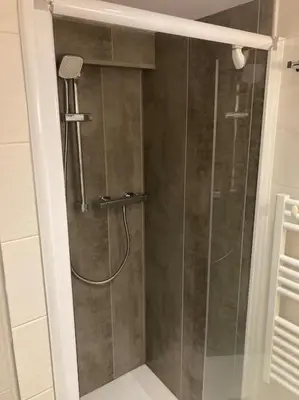 a shower with a glass door in a bathroom at Centre-ville de Cannes 100 m mer in Cannes