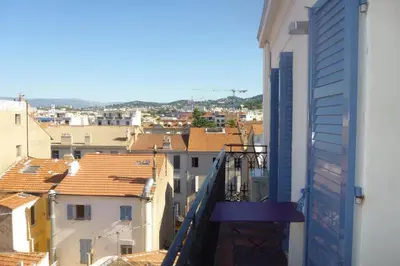 a view of a city from a balcony at REF 990 - Cannes Center - Apartment for rent in Cannes