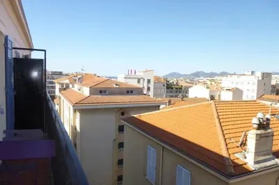 a view of a city from the balcony of a building at REF 990 - Cannes Center - Apartment for rent in Cannes