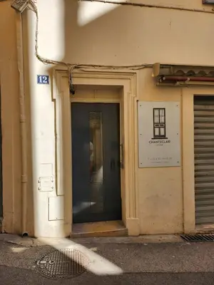 a door to a building with a sign on it at Forville Coeur de Cannes in Cannes