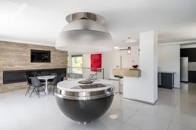 a kitchen and dining room with a large metal bowl at REF 1941 - Cannes Center - Villa for rent in Cannes