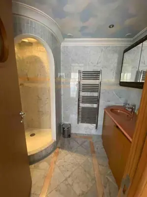a bathroom with a shower and a tub and a sink at Lumineux top terrasse 2P in Cannes