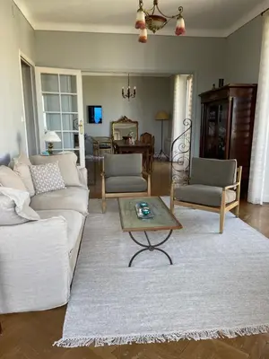 a living room with a couch and a coffee table at Palais Gothique in Cannes
