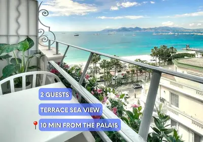 a balcony with a view of the beach and the ocean at Luxury Superbe Studio MIRAMAR Croisette by RIVAEVENT in Cannes