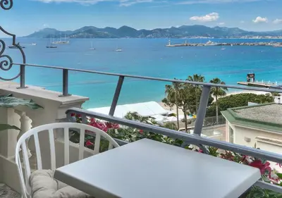 a balcony with a view of the ocean at Luxury Superbe Studio MIRAMAR Croisette by RIVAEVENT in Cannes