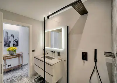a bathroom with a sink and a mirror at Luxury Superbe Studio MIRAMAR Croisette by RIVAEVENT in Cannes