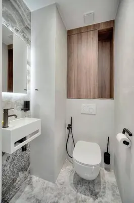 a white bathroom with a toilet and a sink at Luxury Superbe Studio MIRAMAR Croisette by RIVAEVENT in Cannes